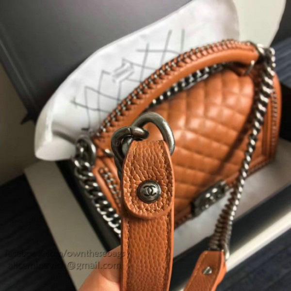 Ch**el caviar grained calfskin boy bag with top handle orange