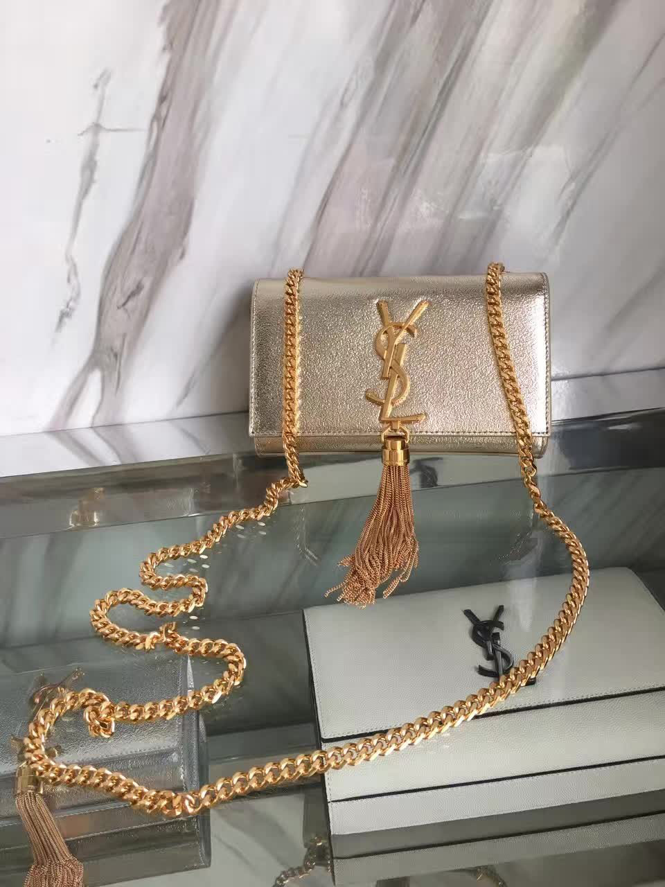 Y51 medium kate bag with leather tassel 5050 24cm x 14cm x 4.5cm