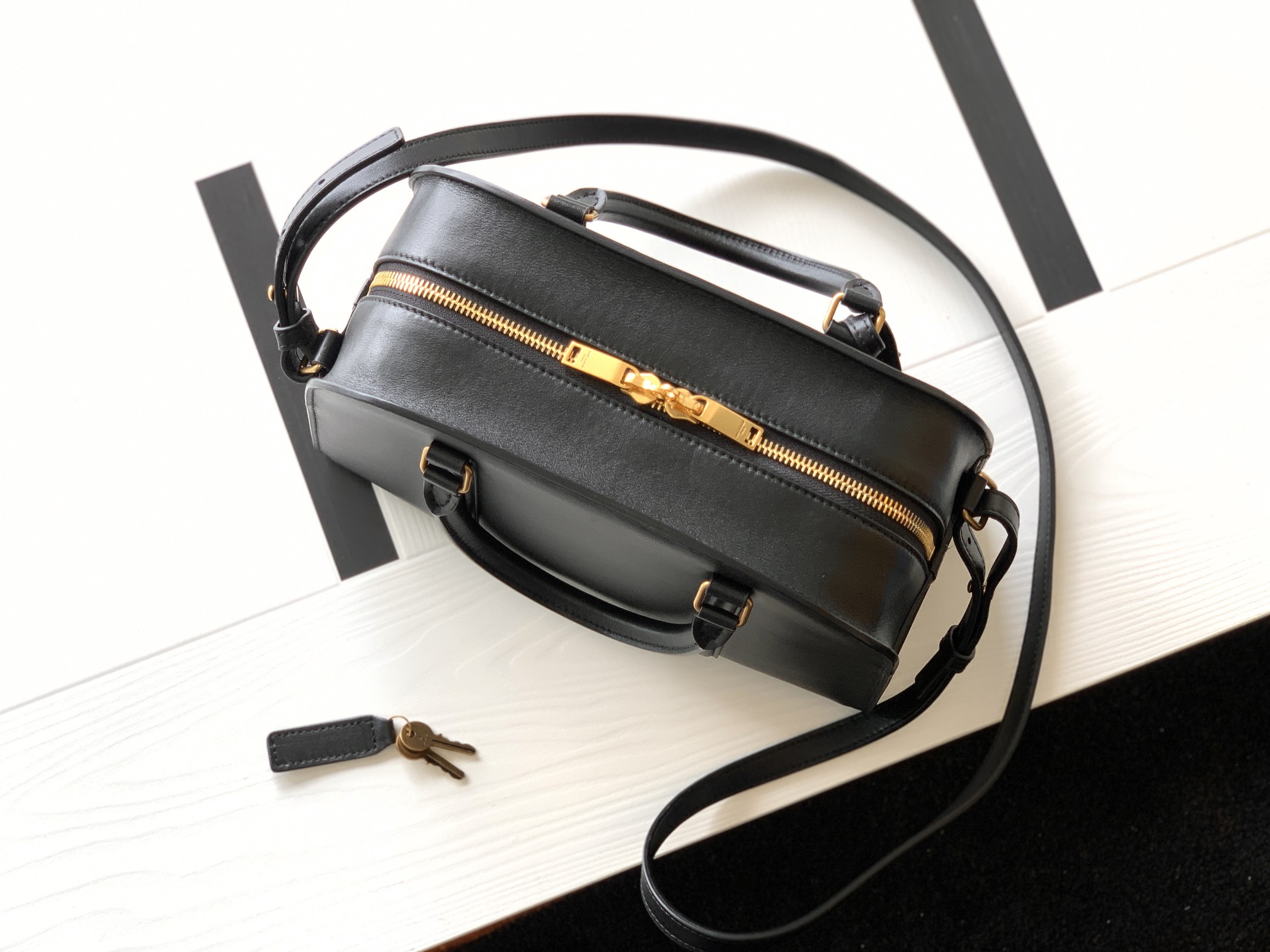 Y51 lock baby duffle in smooth leather 65500816r0w1000 27×18×12cm