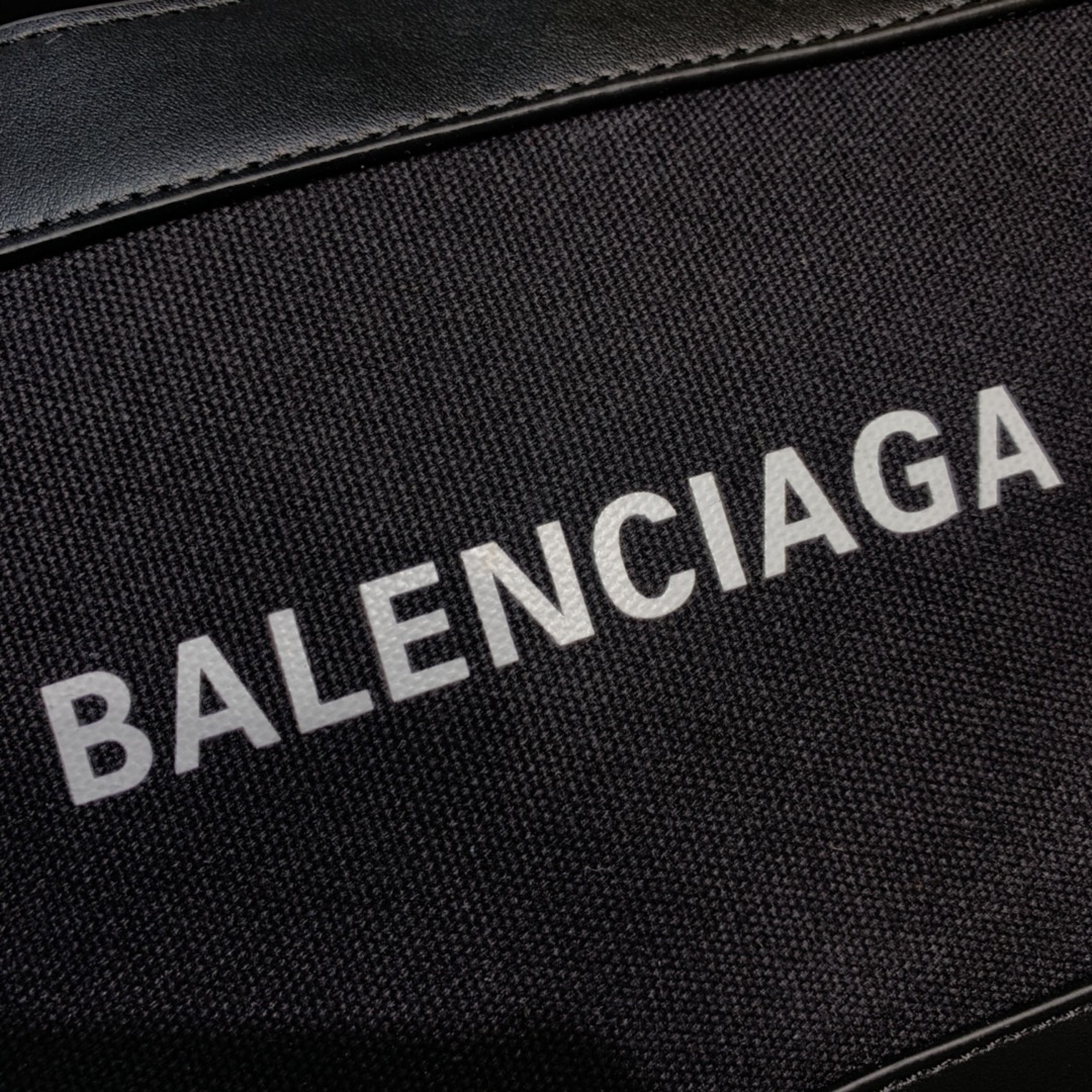Ba1en*iaga leather trimmed canvas shoulder bag in black 26 x 7 x 19 cm