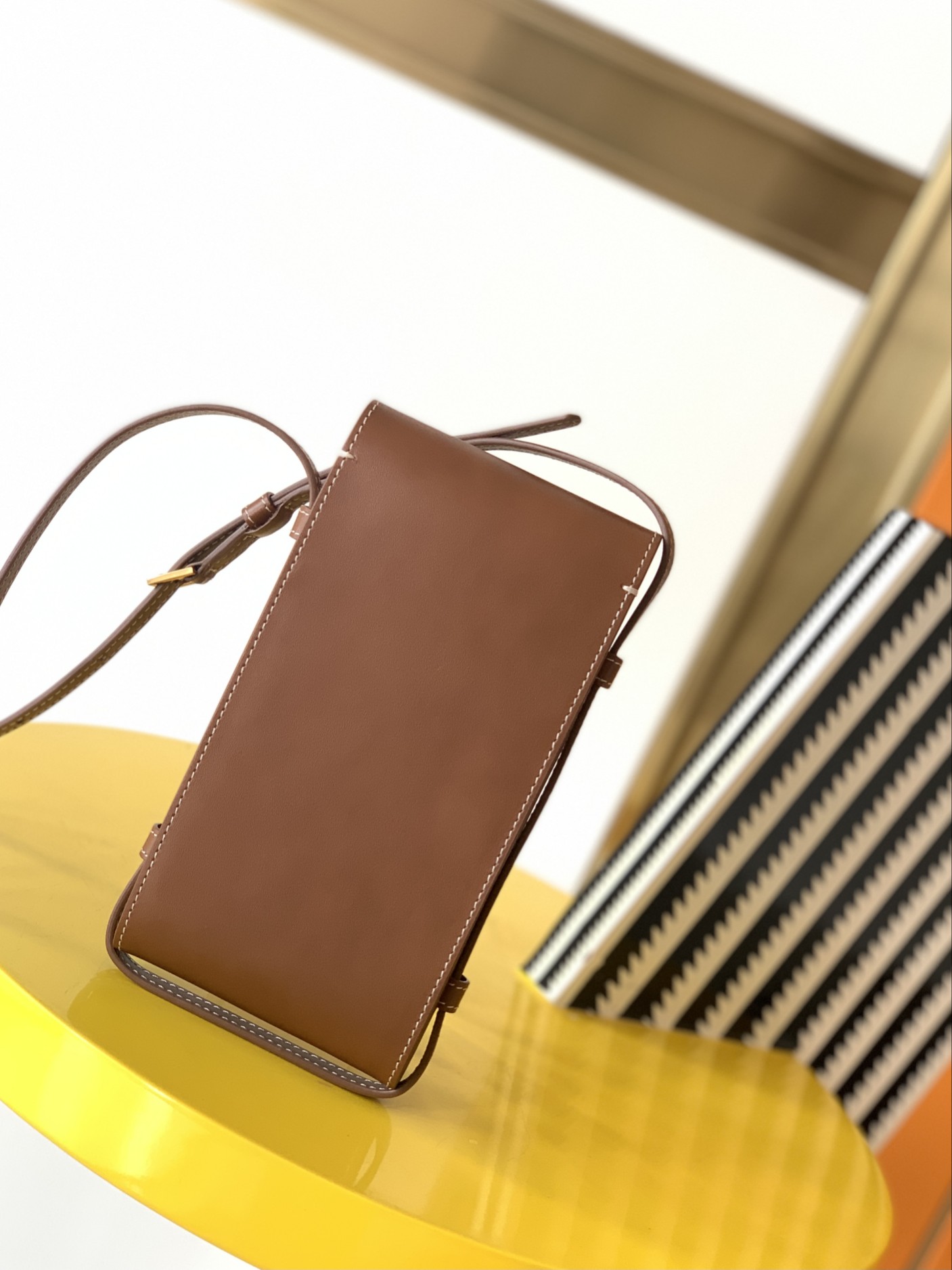 y51 tuc phone pouch with strap in S*pple calfskin brown 6677182 9 x 3.5 x 18 cm